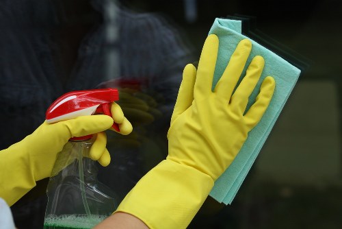 Kitchen surfaces being cleaned in a Battersea apartment