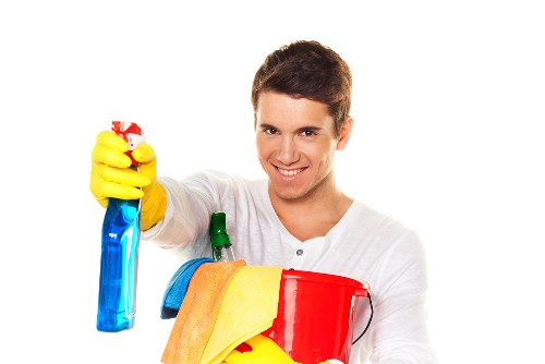 Professional cleaner vacuuming a Battersea family house